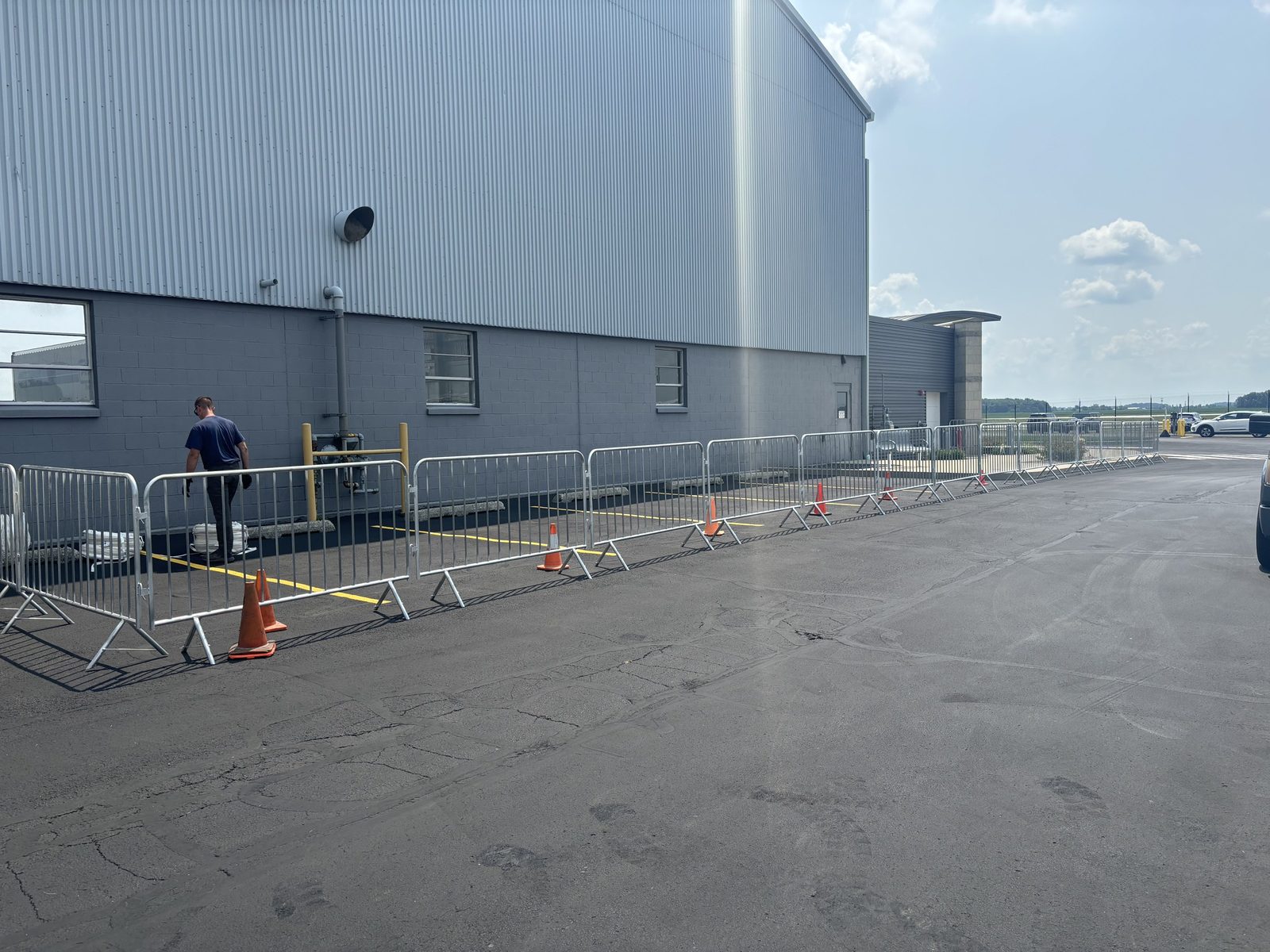 Steel crowd-control barricades lining the outside of a venue