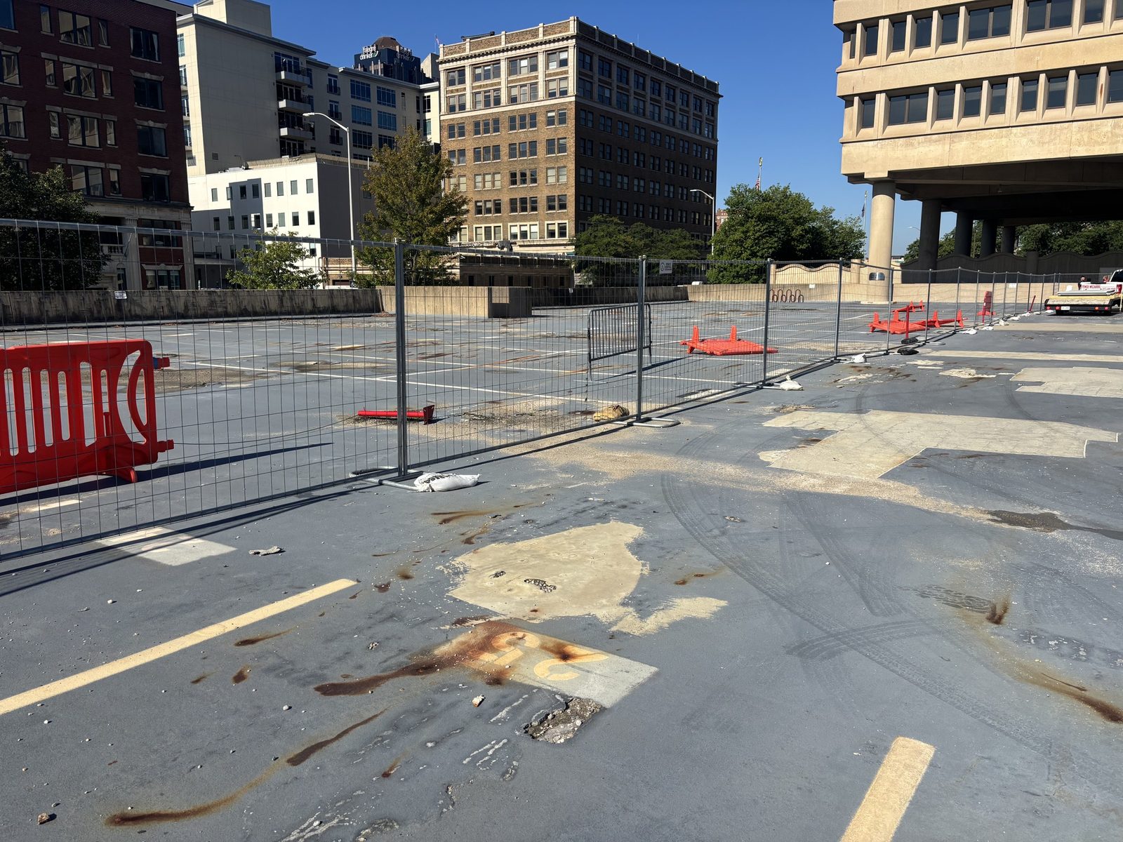 Barricades separating a downtown parking lot